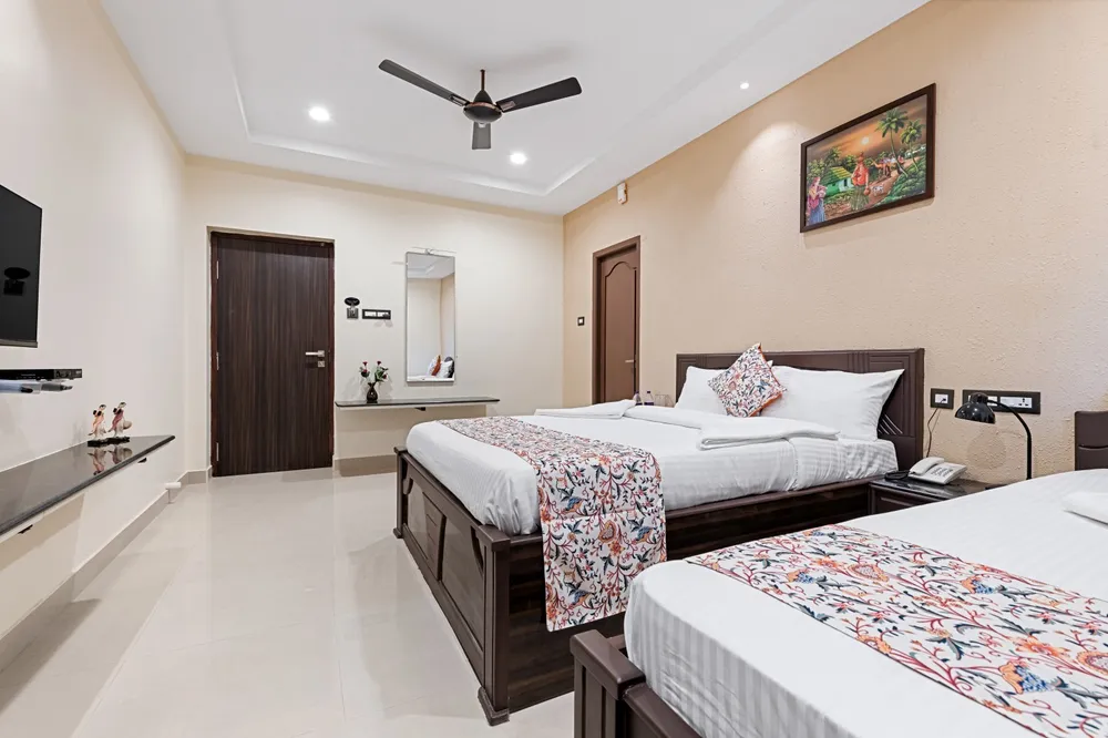 Deluxe Plus Room TV & Desk Setup — Veera Residency