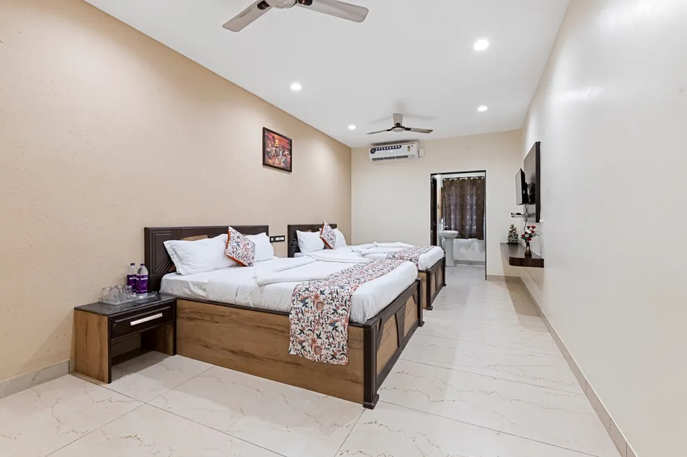 Spacious Family Room Dual Bed Setup — Veera Residency